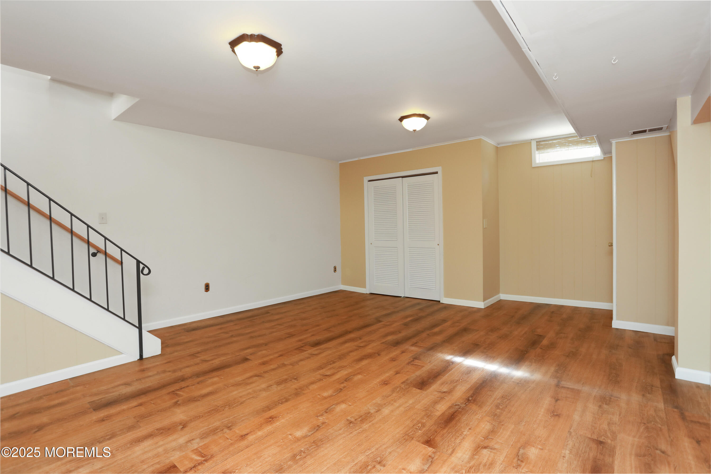 12 Wyckham Road Spring Lake Heights, NJ 07762 - Photo 22 of 39 a view of empty room with wooden floor