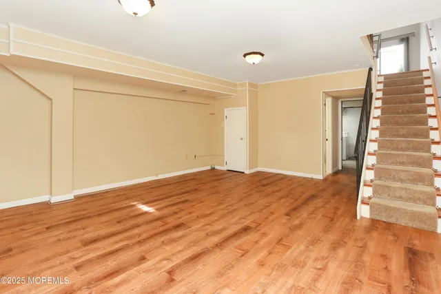 a bathroom with a sink mirror and shower