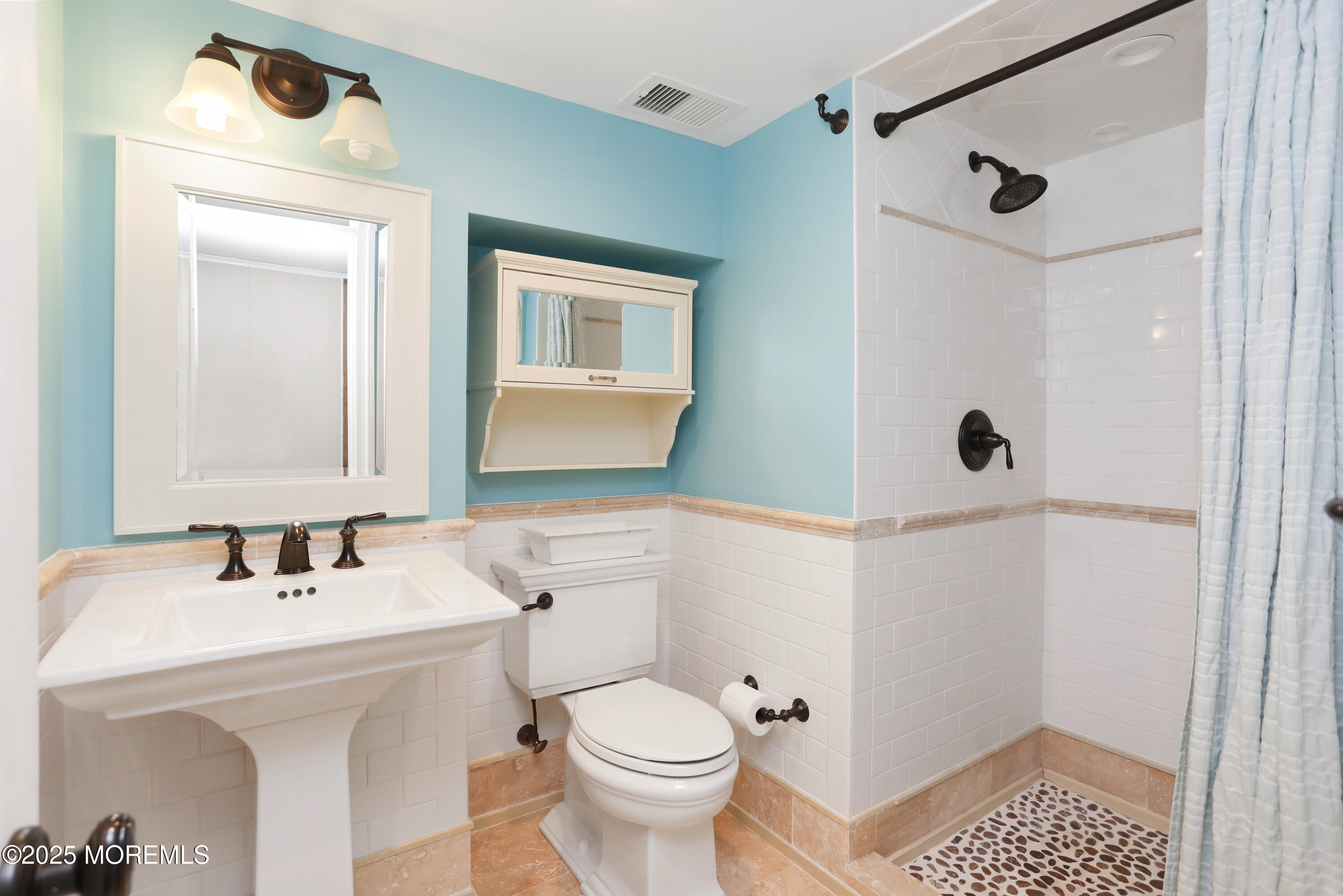 12 Wyckham Road Spring Lake Heights, NJ 07762 - Photo 24 of 39 a bathroom with a sink a toilet and shower