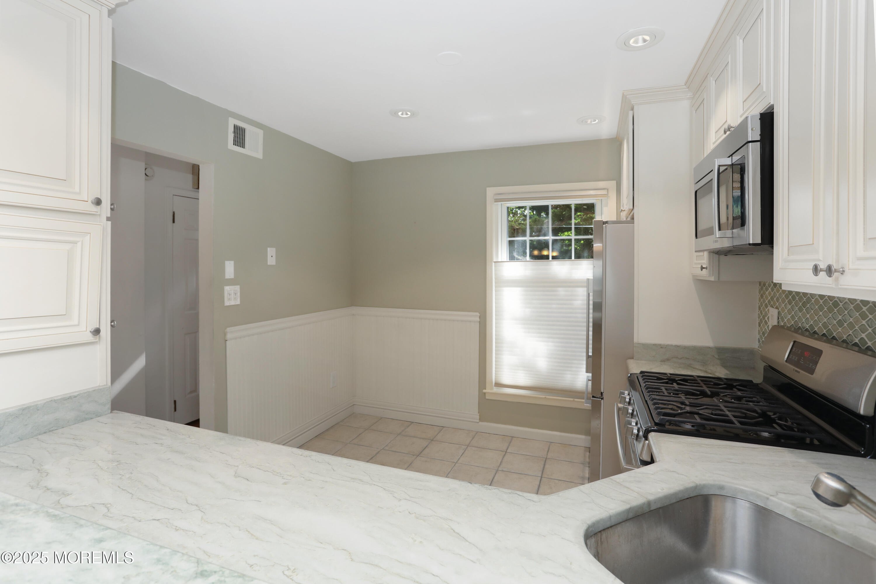 12 Wyckham Road Spring Lake Heights, NJ 07762 - Photo 5 of 39 a bathroom with a sink a toilet and shower