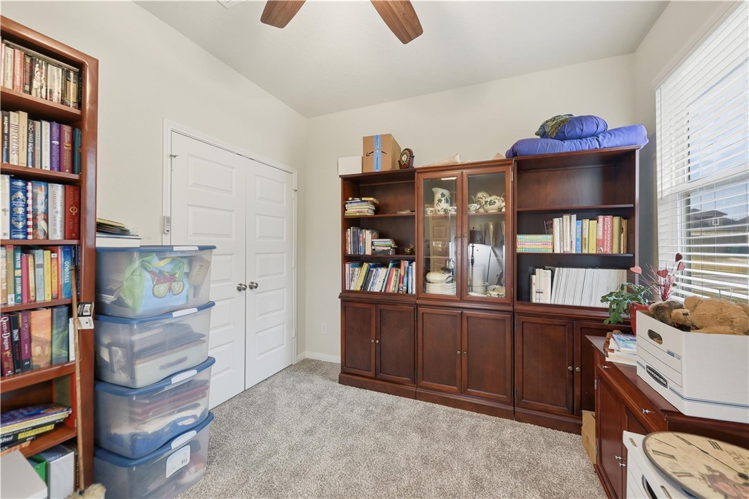 1443 Lk Rdg Drive Brenham, TX 77833 - Photo 13 of 17 a room with lots of books and furniture