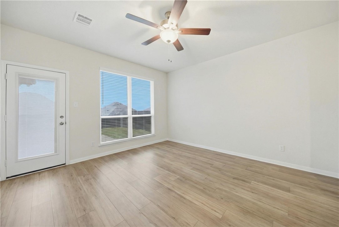 1443 Lk Rdg Drive Brenham, TX 77833 - Photo 8 of 17 wooden floor in an empty room with a window