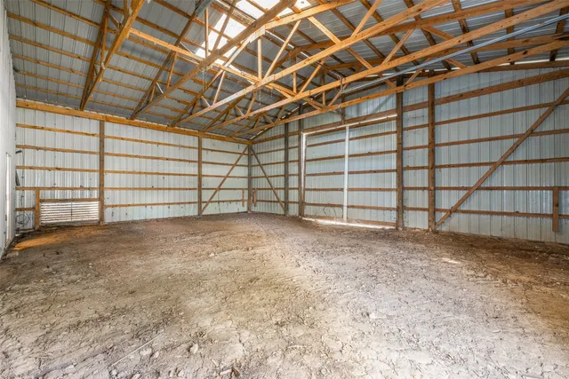 a view of a room with wooden walls