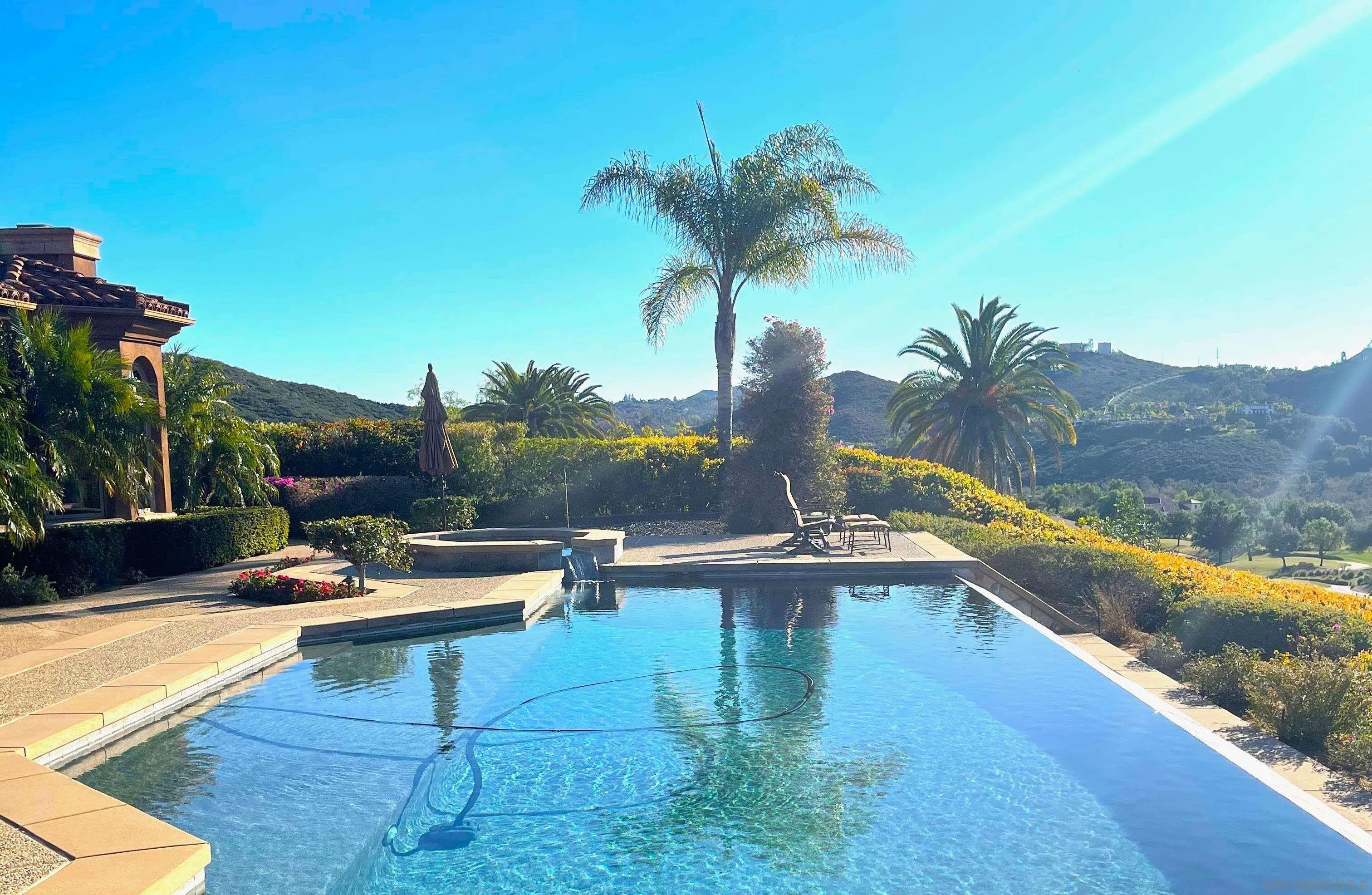 18210 Old Coach Drive Poway, CA 92064 - Photo 4 of 5 a view of a swimming pool with a lounge chair