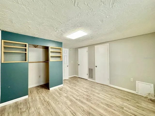 a view of an empty room and window