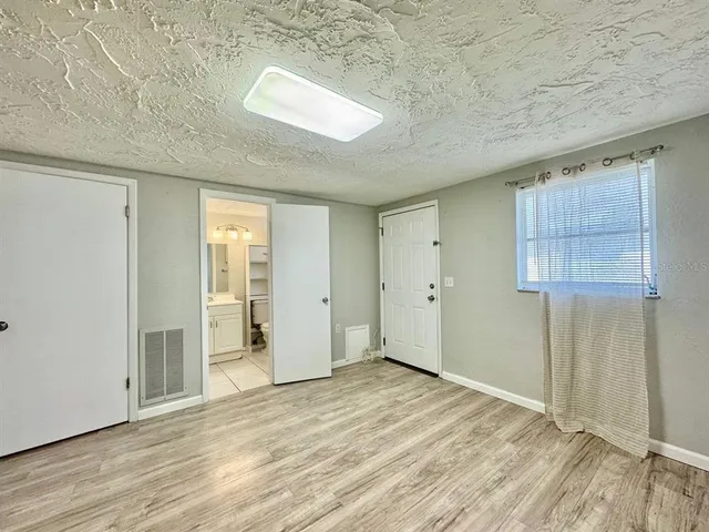a bathroom with a sink toilet tub and shower
