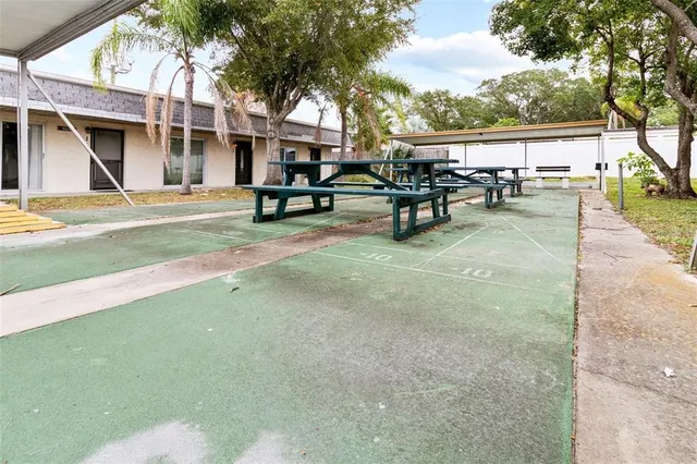 a view of swimming pool with seating area