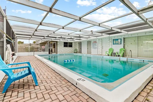 a view of a swimming pool with a porch