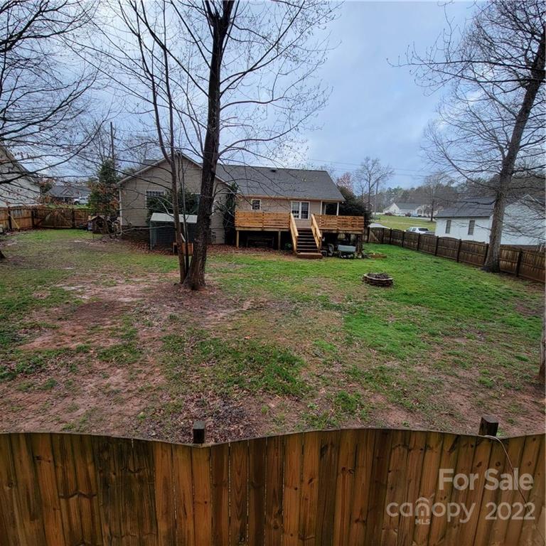 1744 Furnace Road Lincolnton, NC 28092 - Photo 14 of 15 a backyard of a house with trees and outdoor seating
