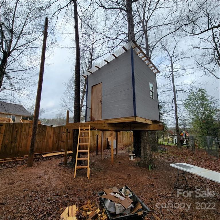 1744 Furnace Road Lincolnton, NC 28092 - Photo 15 of 15 a backyard of a house with barbeque oven table and chairs