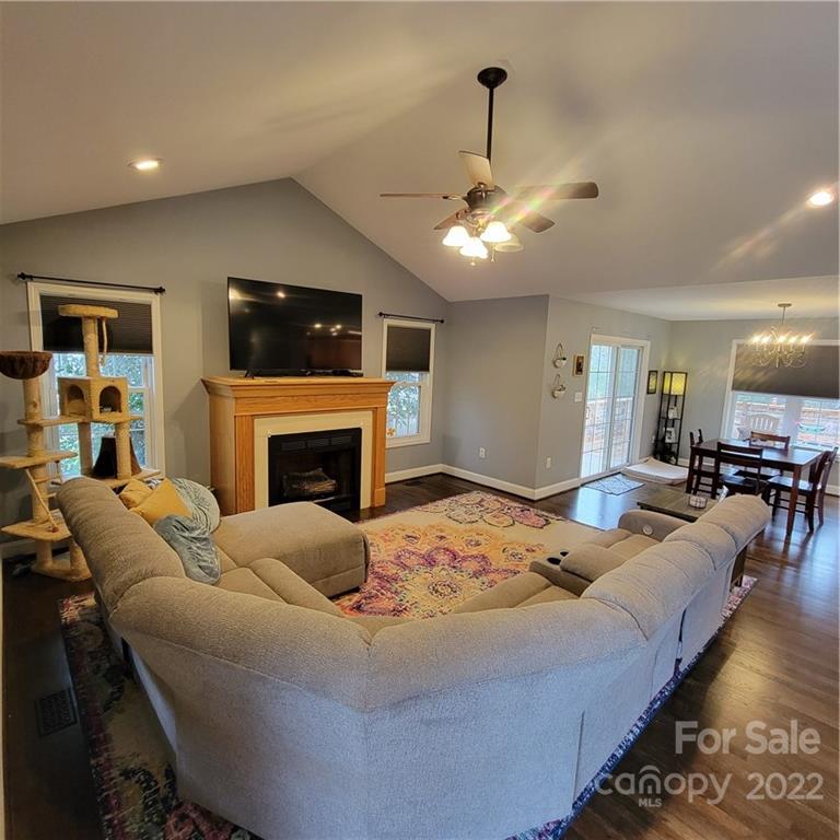1744 Furnace Road Lincolnton, NC 28092 - Photo 2 of 15 a living room with furniture a flat screen tv and a fireplace