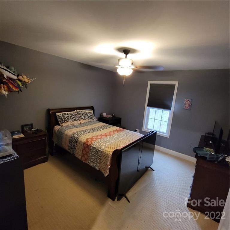 1744 Furnace Road Lincolnton, NC 28092 - Photo 8 of 15 a bedroom with a bed and a window