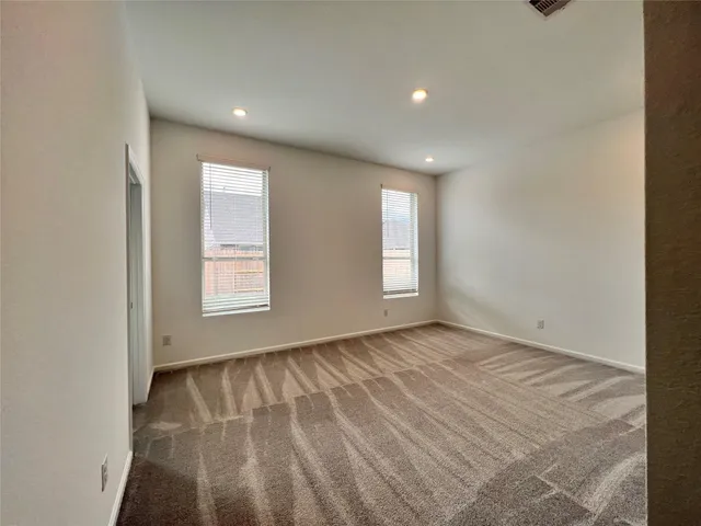 a view of an empty room and window