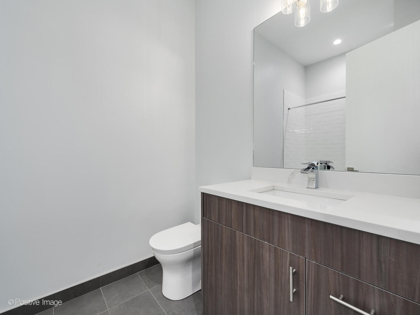 2139 West Madison Street, Unit 212 Chicago, IL 60612 - Photo 8 of 11 a bathroom with a sink and a toilet