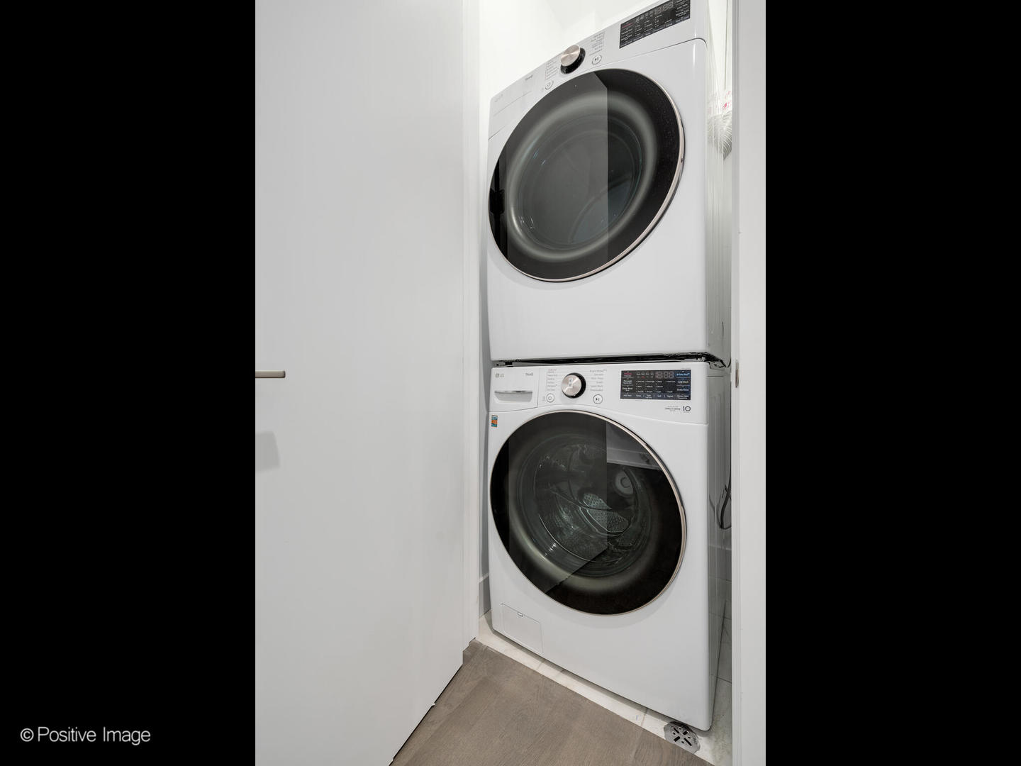 2139 West Madison Street, Unit 212 Chicago, IL 60612 - Photo 9 of 11 a view of a washer and dryer in a utility room
