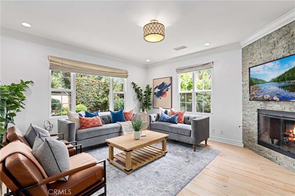 25 Longvale Irvine, CA 92602 - Photo 12 of 58 a living room with furniture and a fireplace