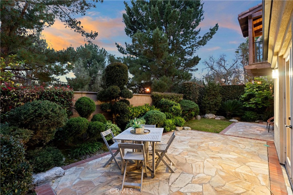 25 Longvale Irvine, CA 92602 - Photo 25 of 58 a backyard of a house with a yard and outdoor seating
