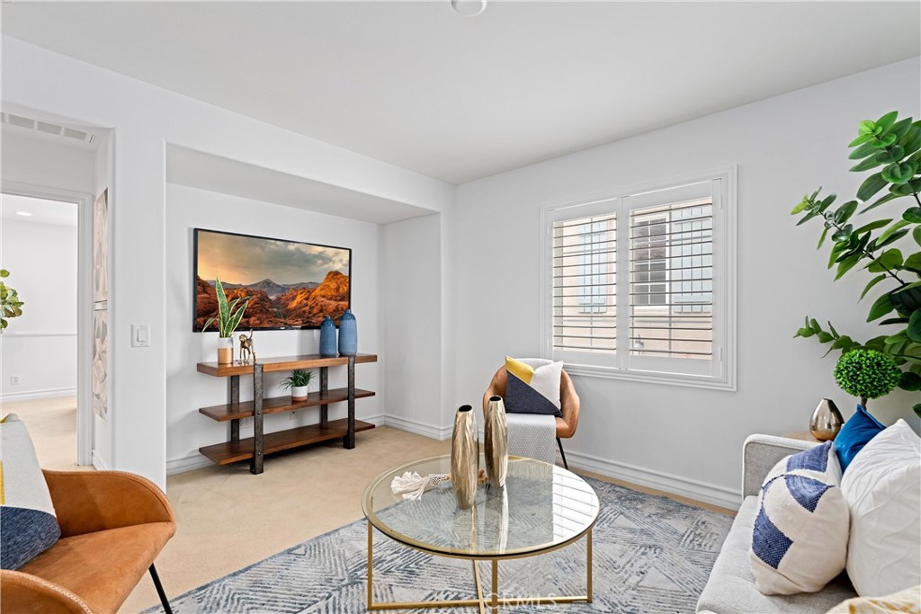 25 Longvale Irvine, CA 92602 - Photo 38 of 58 a living room with furniture a window and a potted plant