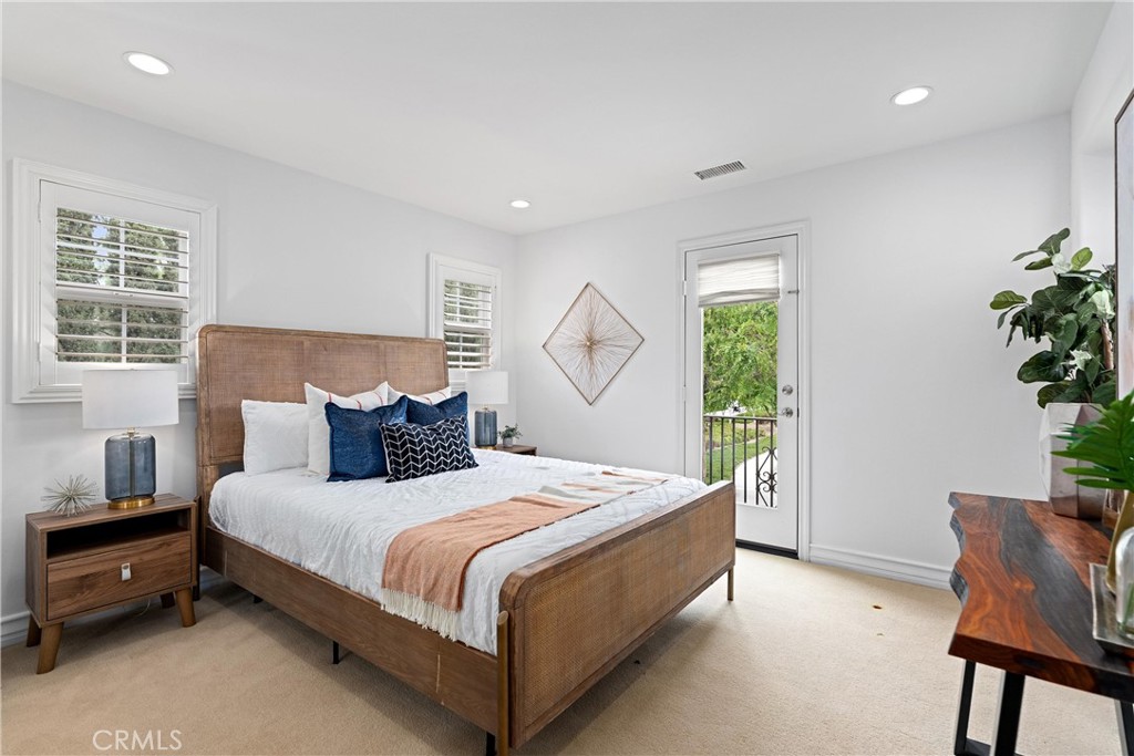 25 Longvale Irvine, CA 92602 - Photo 43 of 58 a bedroom with a bed and a potted plant