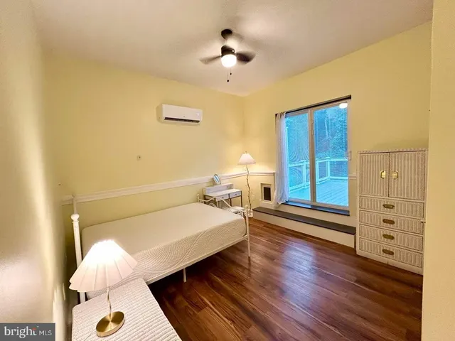 a living room with furniture and a chair