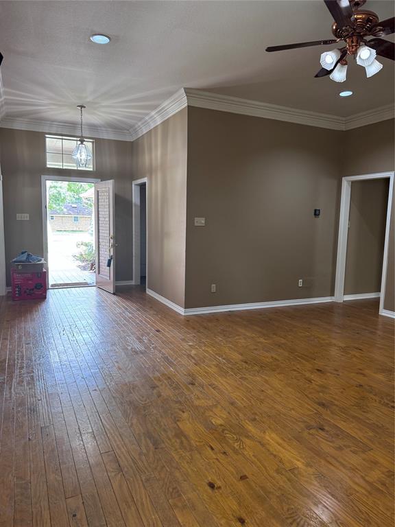 1704 South Bowen Road Pantego, TX 76013 - Photo 2 of 37 Entryway opens to the spacious living room