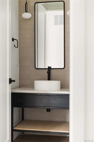 a bathroom with a sink and a mirror