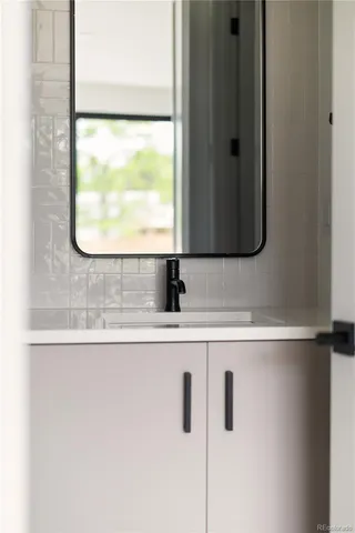 a bathroom with a sink and a window