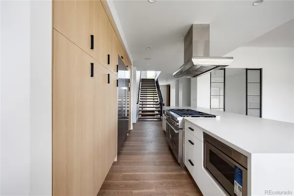 a kitchen with a stove and a refrigerator