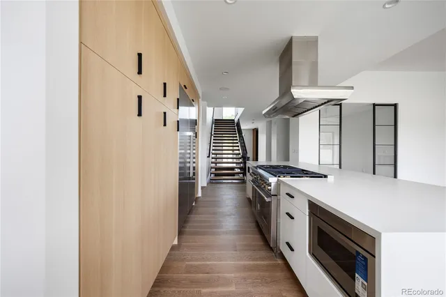 a kitchen with a stove and a refrigerator