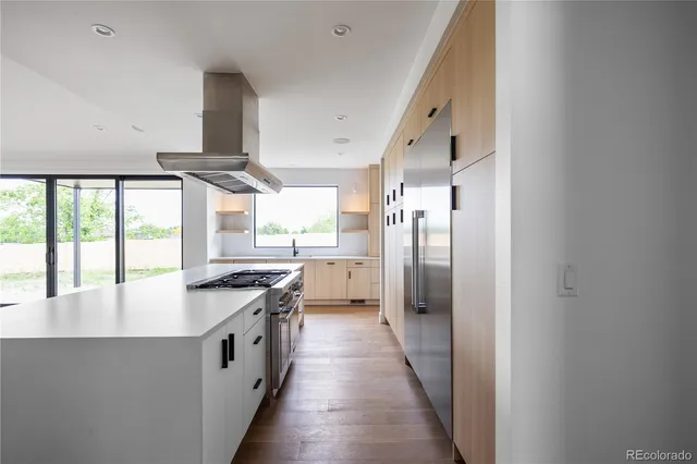 a kitchen with stainless steel appliances a sink and a stove