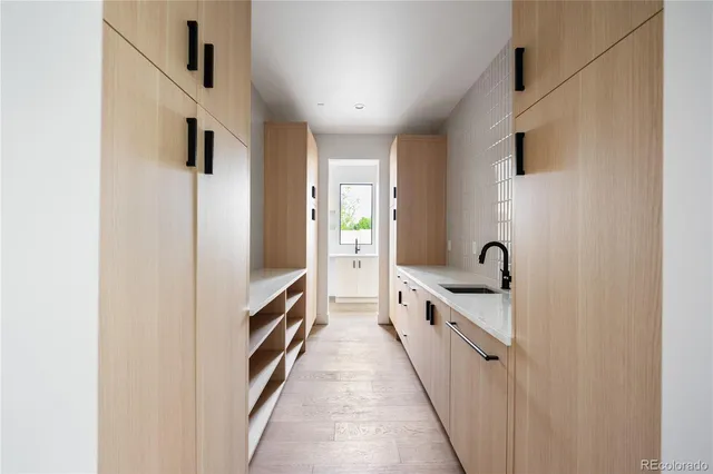 a kitchen with stainless steel appliances a refrigerator and a stove