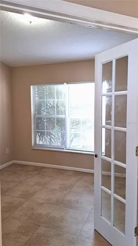 a view of an empty room with a window