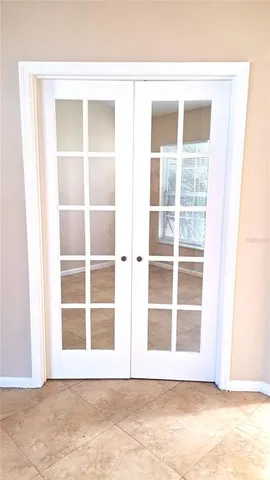 a view of wooden floor and windows in a room