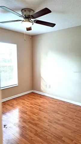 a view of an empty room and wooden floor