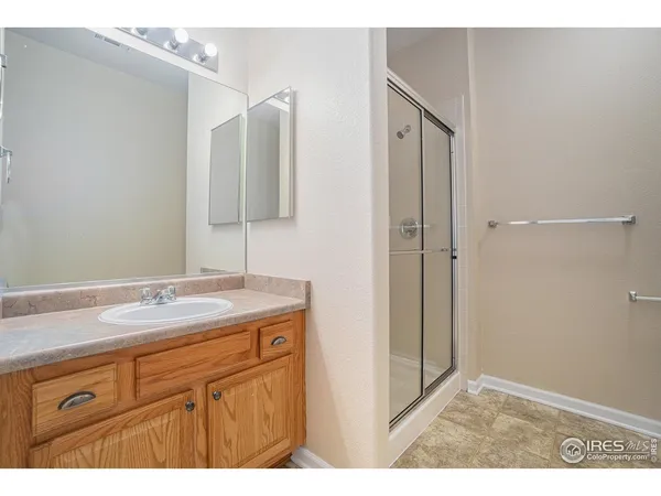 a bathroom with a granite countertop sink mirror and vanity