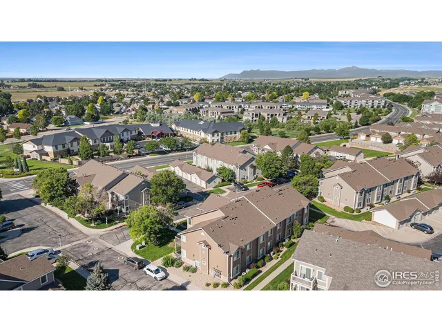 an aerial view of residential houses with city view