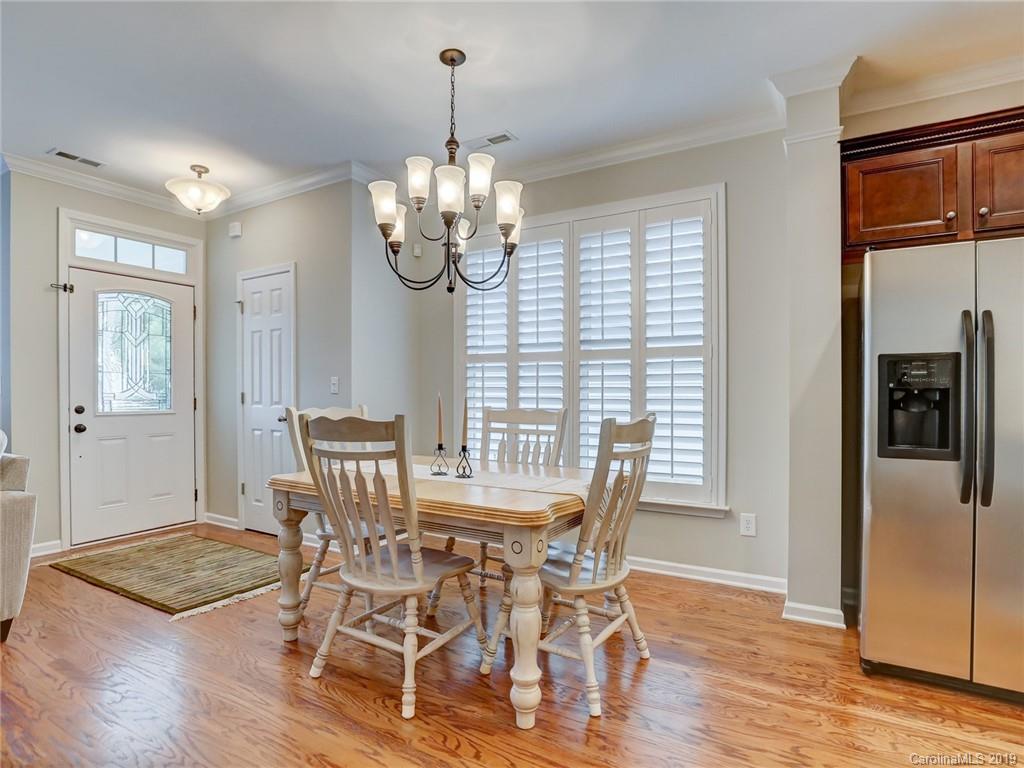 3462 Richard's Crossing Fort Mill, SC 29708 - Photo 11 of 42 a view of a dining room with furniture window and wooden floor