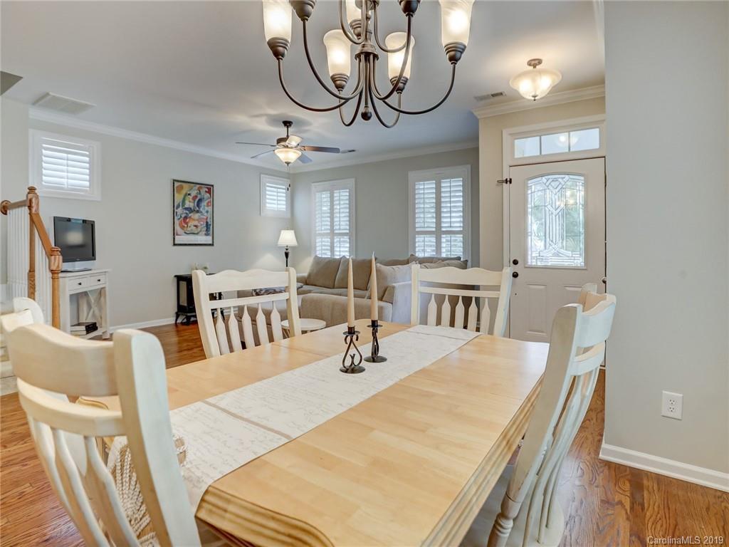 3462 Richard's Crossing Fort Mill, SC 29708 - Photo 12 of 42 a bedroom with a bed a chandelier and flat screen tv