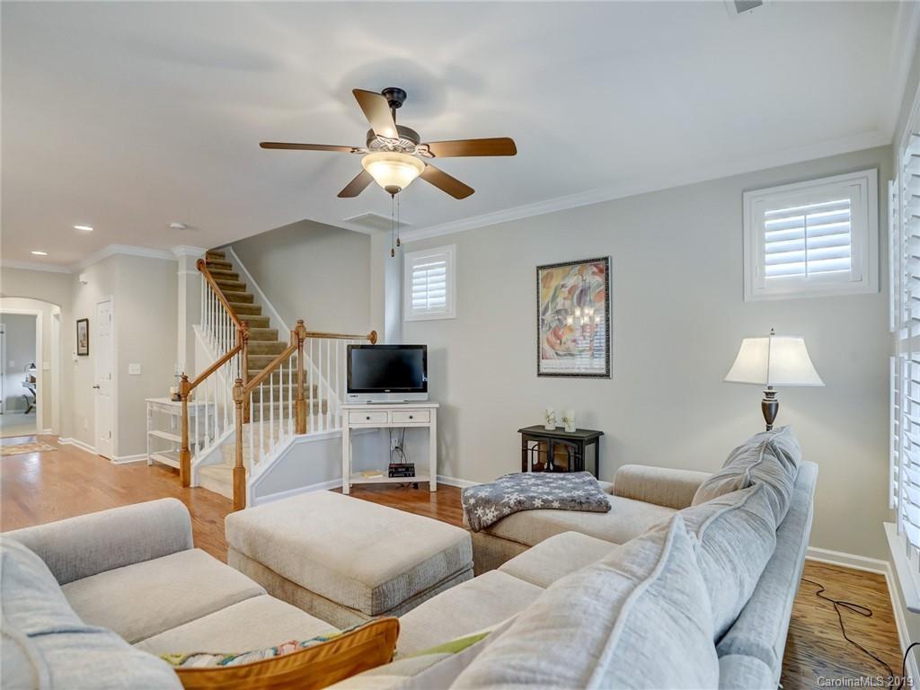3462 Richard's Crossing Fort Mill, SC 29708 - Photo 14 of 42 a living room with furniture a chandelier and a flat screen tv