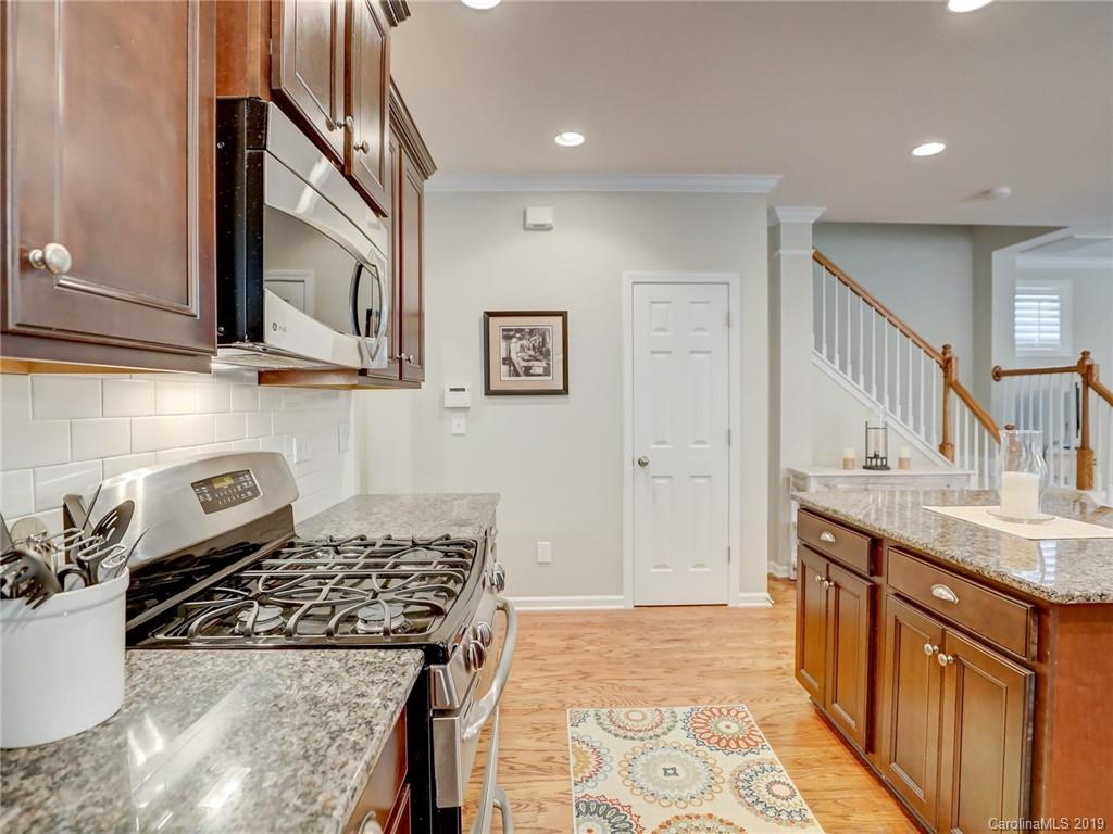 3462 Richard's Crossing Fort Mill, SC 29708 - Photo 20 of 42 a kitchen with stainless steel appliances granite countertop a stove and a sink