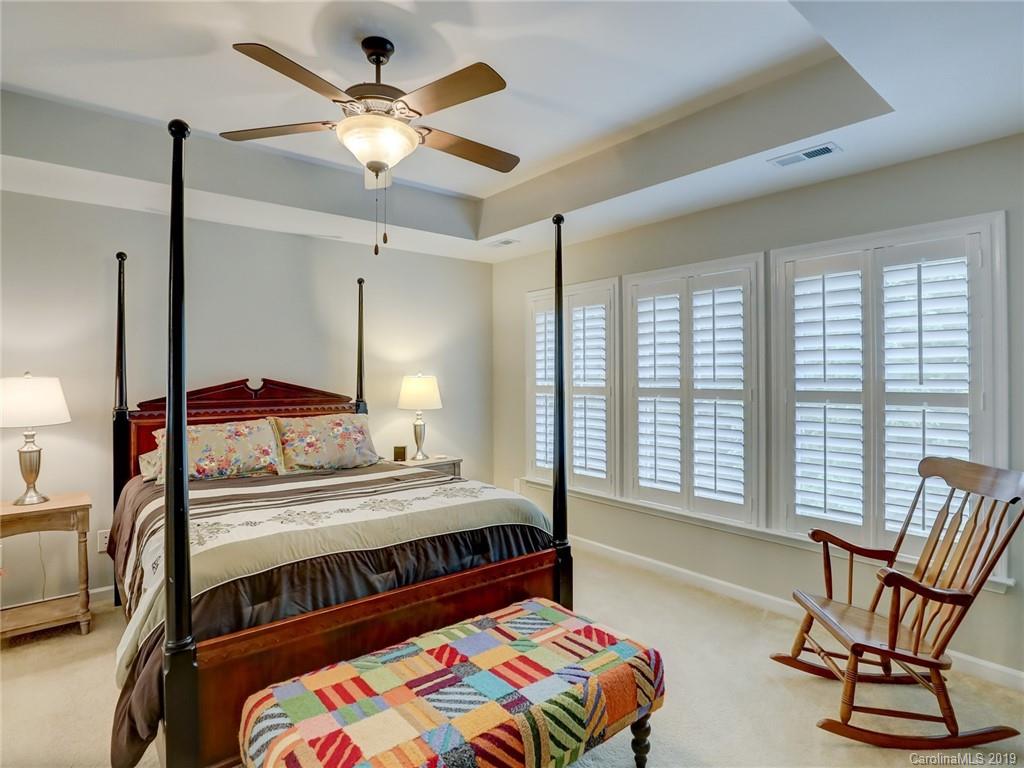 3462 Richard's Crossing Fort Mill, SC 29708 - Photo 26 of 42 a bedroom with a bed and a chandelier