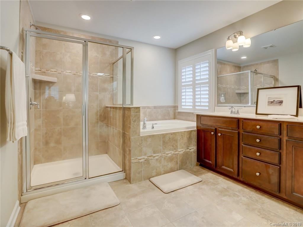3462 Richard's Crossing Fort Mill, SC 29708 - Photo 28 of 42 a bathroom with a tub sink shower and mirror