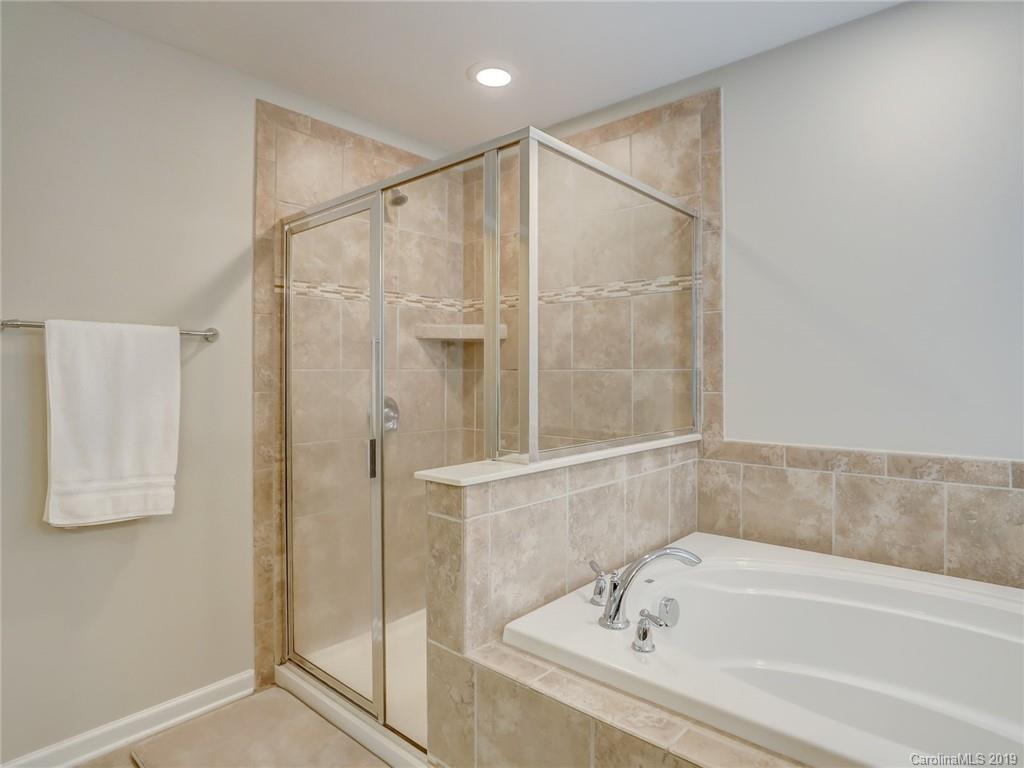 3462 Richard's Crossing Fort Mill, SC 29708 - Photo 30 of 42 a bathroom with a bathtub and a shower