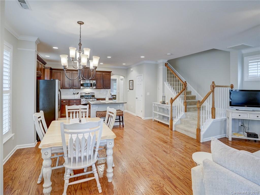 3462 Richard's Crossing Fort Mill, SC 29708 - Photo 8 of 42 a view of a dining room with furniture a kitchen and chandelier