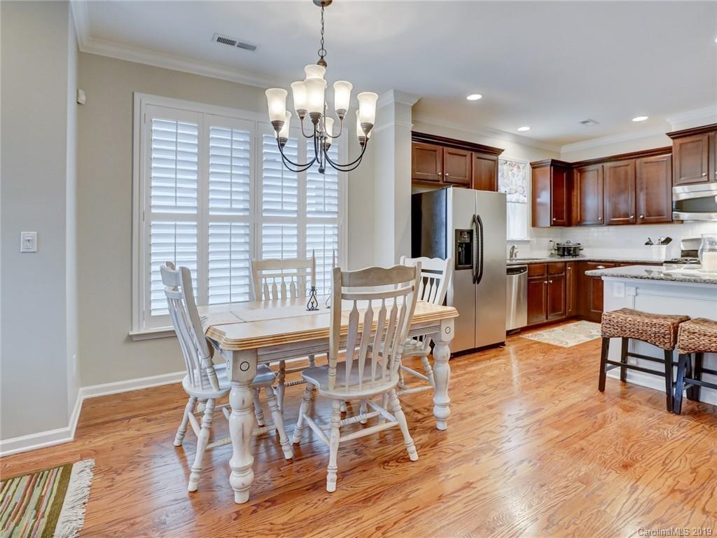 3462 Richard's Crossing Fort Mill, SC 29708 - Photo 10 of 42 a view of a dining room with furniture wooden floor and chandelier
