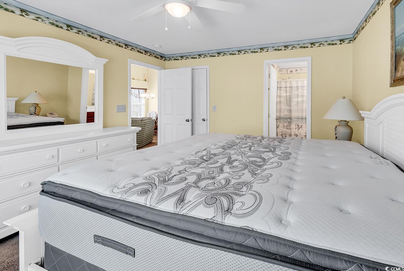 4909 Britewater Court, Unit 202 Myrtle Beach, SC 29579 - Photo 21 of 38 Bedroom with ensuite bathroom and a ceiling fan