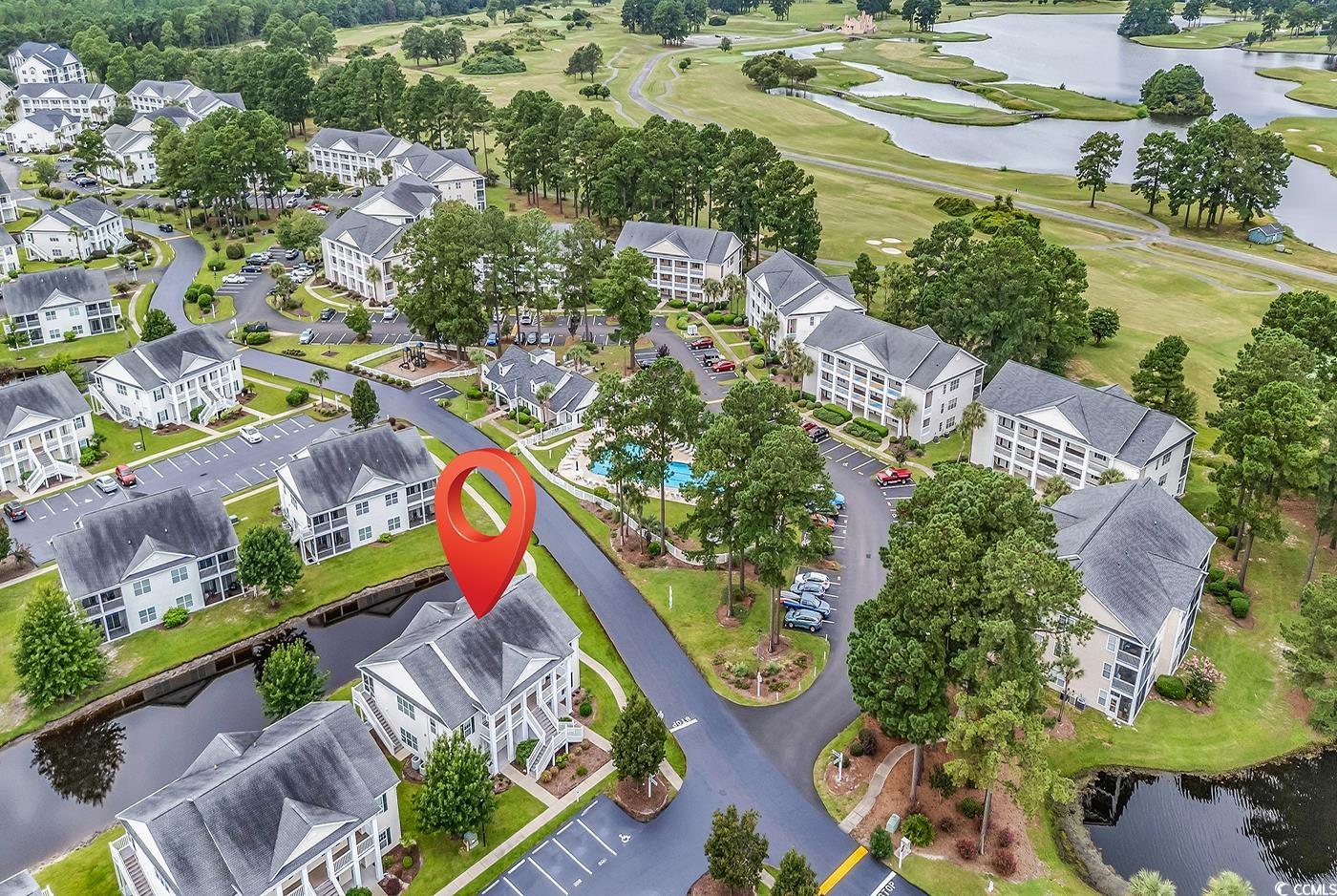 4909 Britewater Court, Unit 202 Myrtle Beach, SC 29579 - Photo 29 of 38 Aerial overview of property's location with a nearby body of water and nearby suburban area