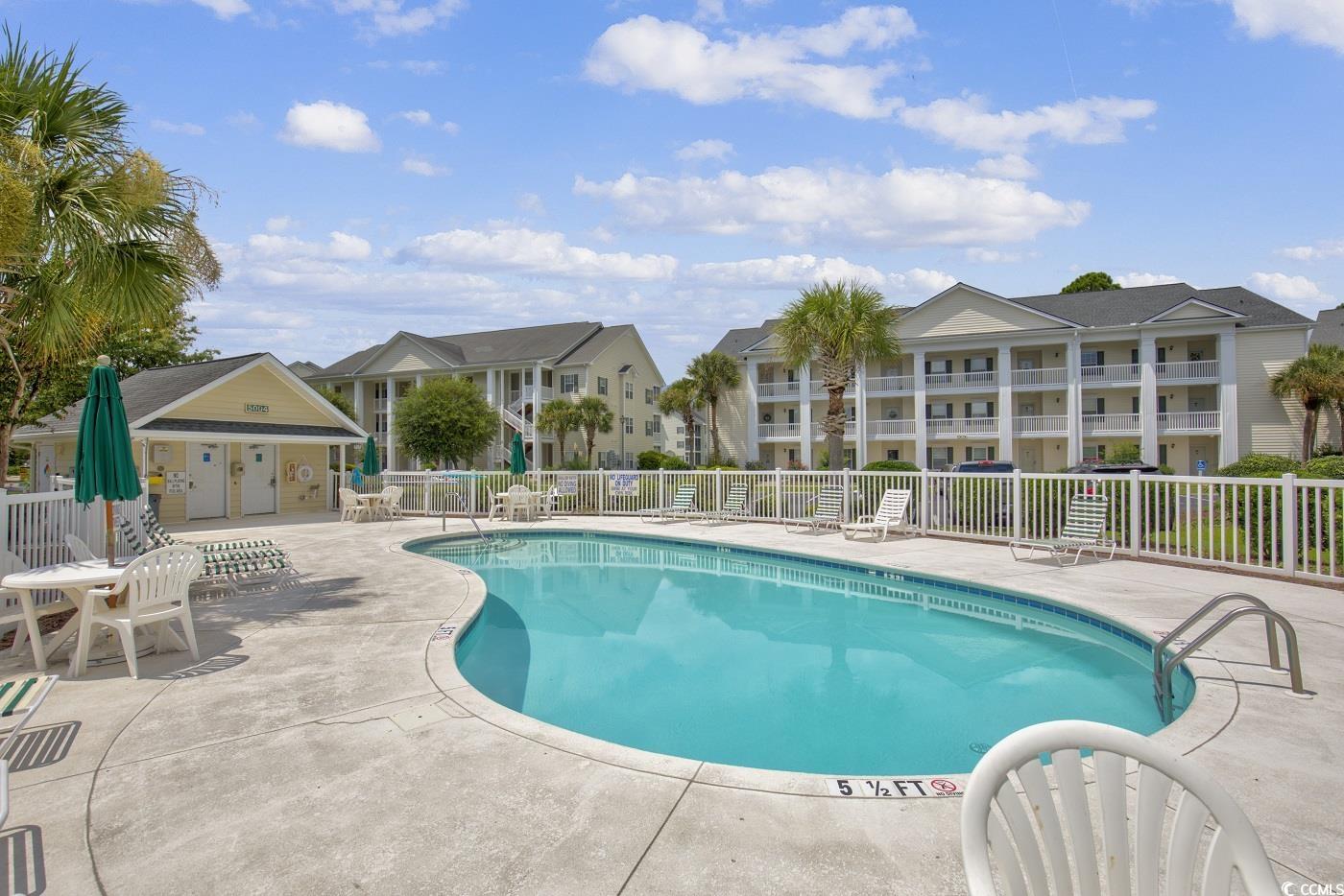 4909 Britewater Court, Unit 202 Myrtle Beach, SC 29579 - Photo 34 of 38 Community pool featuring a patio area