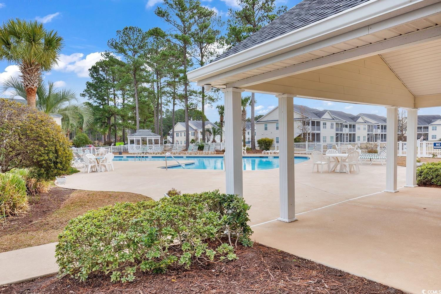 4909 Britewater Court, Unit 202 Myrtle Beach, SC 29579 - Photo 37 of 38 Community pool with a patio area and a gazebo