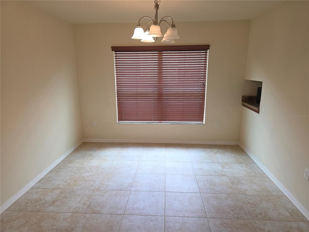4284 High Ridge Avenue Spring Hill, FL 34609 - Photo 8 of 40 a view of an empty room with a window
